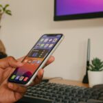 person holding silver iphone 6