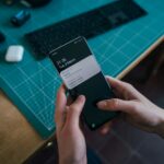 person holding black android smartphone